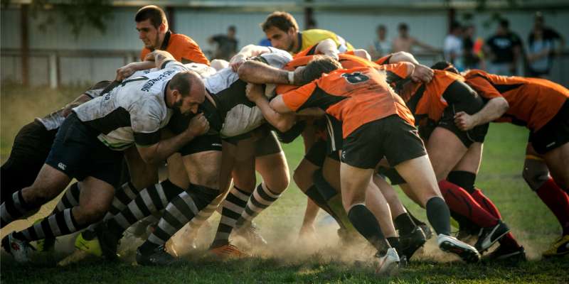 two rugby teams involved in a scrum