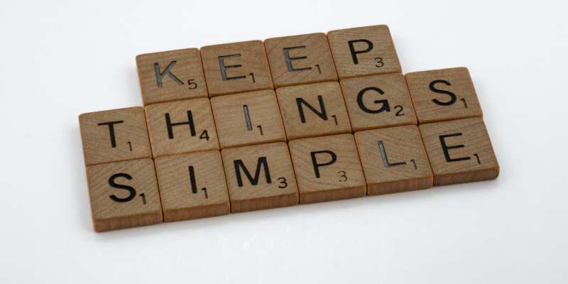 Scrabble tiles in three rows reading keep things simple