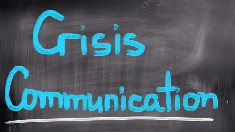 crisis communication written on a chalkboard