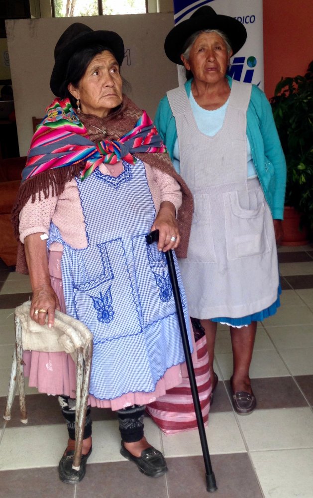 two women in black hats